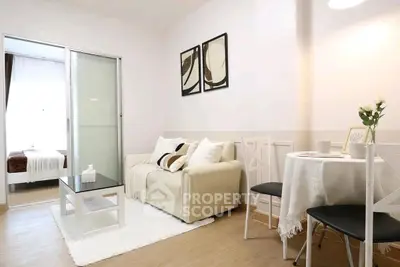 Modern living room with cozy sofa and stylish decor in a bright apartment.