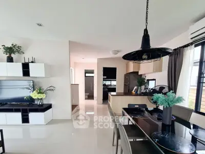 Modern open-plan living and dining area with stylish decor and natural light.