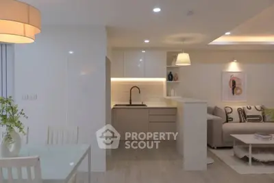 Modern open-plan living room with stylish kitchen and cozy seating area