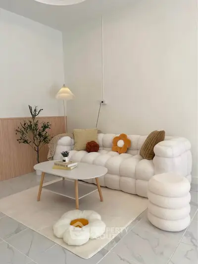 Chic modern living room with plush white sofa and stylish decor