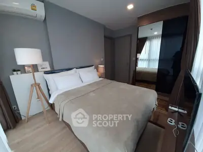 Cozy modern bedroom with elegant decor and ample natural light