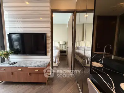 Luxurious modern apartment interior with stylish bedroom and sleek kitchen design.