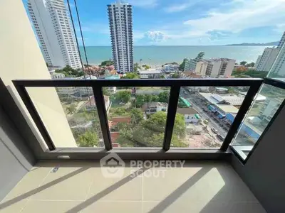 Stunning balcony view overlooking cityscape and ocean, perfect for relaxation.
