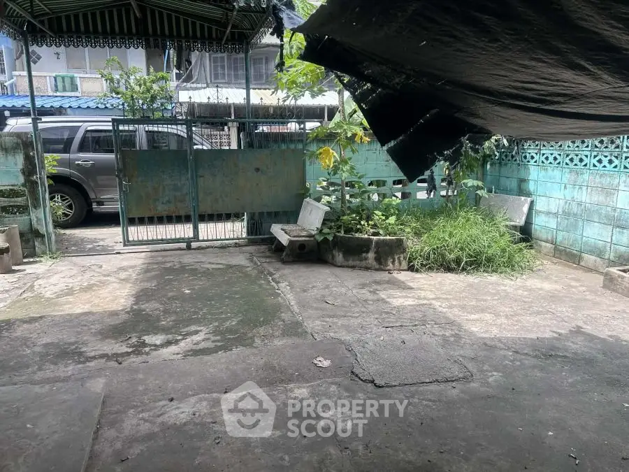 Spacious outdoor area with potential for garden or patio transformation.