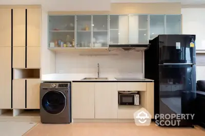 Modern kitchen with sleek appliances and ample storage space