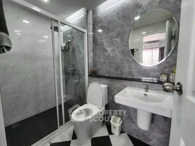 Modern bathroom with sleek design and glass shower enclosure