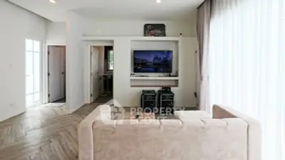 Modern living room with stylish decor and entertainment setup