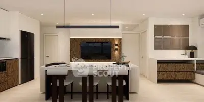 Modern open-layout kitchen and dining area with sleek design and contemporary furnishings.