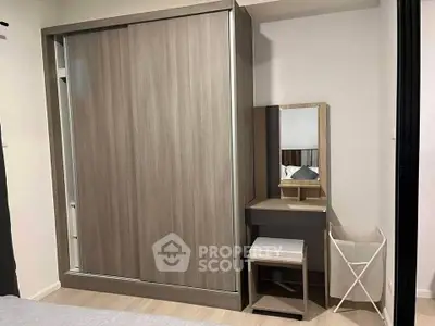 Modern bedroom with sleek wardrobe and stylish vanity set
