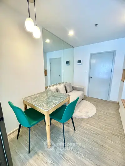 Modern living room with stylish dining area and cozy seating in a contemporary apartment.