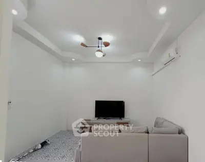 Modern living room with stylish ceiling lights and cozy sofa