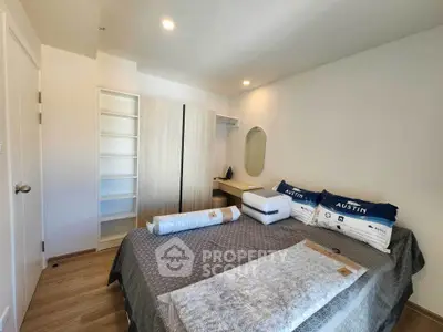 Cozy bedroom with modern decor and ample storage space