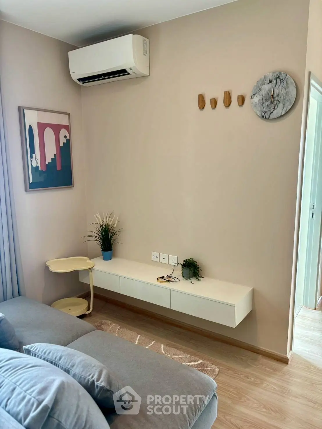Modern living room with stylish decor and air conditioning
