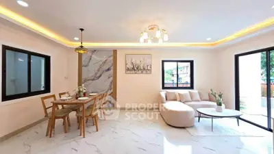 Spacious modern living room with elegant dining area and large windows for natural light.