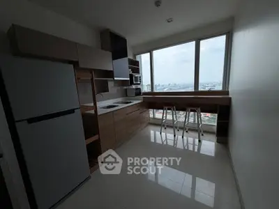 Modern kitchen with panoramic city view and sleek cabinetry