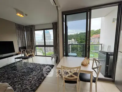 Modern living room with balcony view in high-rise apartment