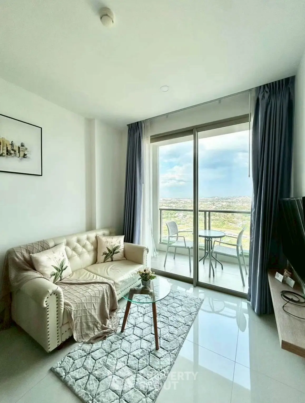 Bright living room with balcony and stunning city view