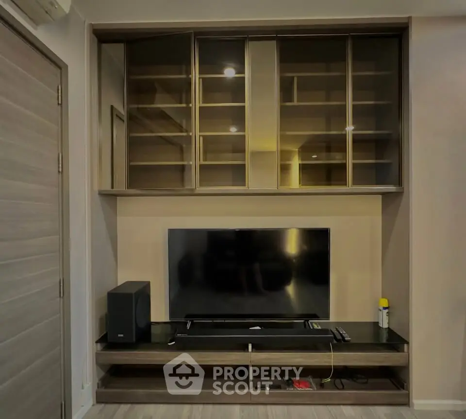 Modern living room with sleek TV unit and ample storage space