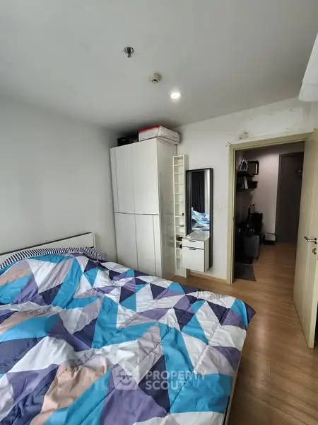 Cozy bedroom with modern decor and ample storage space