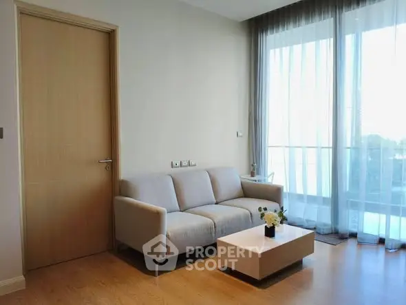 Modern living room with cozy sofa and natural light