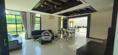 Spacious modern living room with elegant ceiling design and natural light