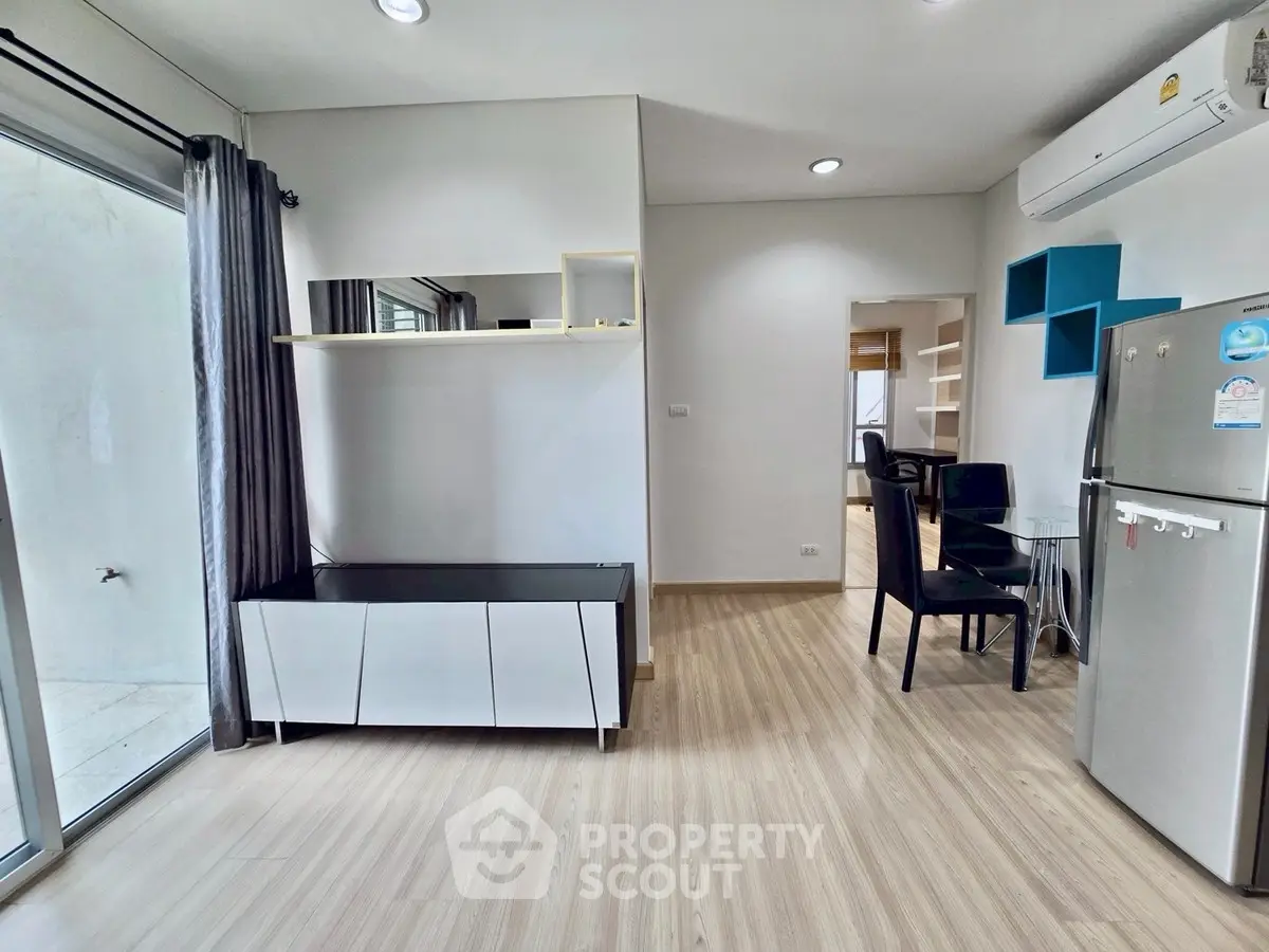 Modern living room with sleek furniture and air conditioning