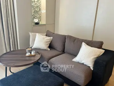 Cozy living room with modern sofa and stylish coffee table, perfect for relaxation and entertaining.