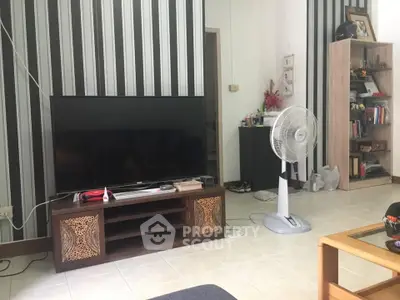 Cozy living room with modern TV setup and stylish decor