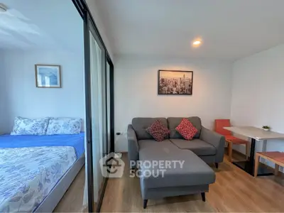 Modern studio apartment with cozy living area and stylish decor
