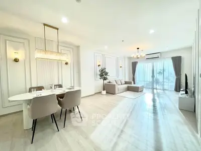 Spacious modern living room with elegant dining area and natural light