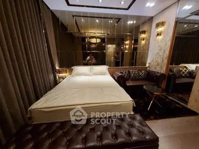 Luxurious bedroom with elegant decor and mirrored walls