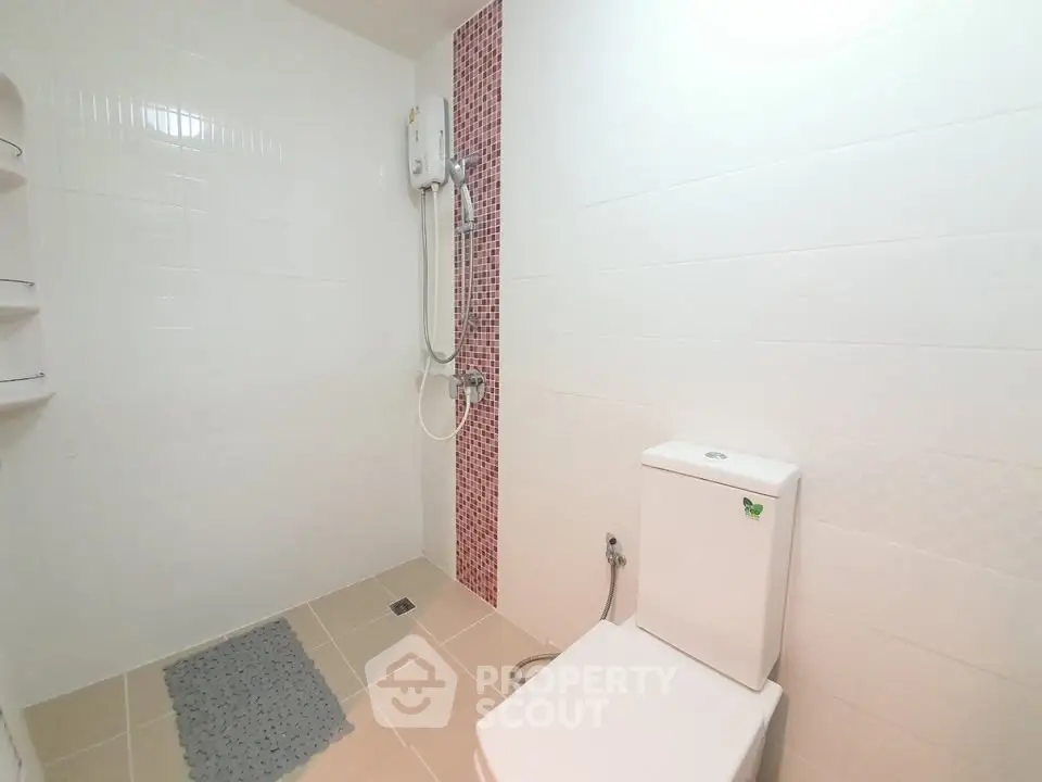 Modern bathroom with shower and toilet in minimalist design