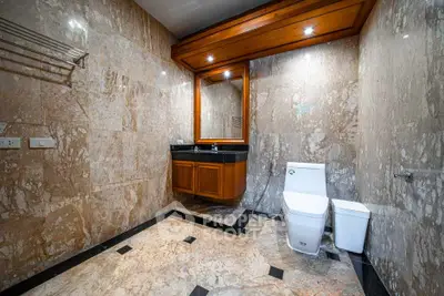 Luxurious marble bathroom with elegant fixtures and spacious design