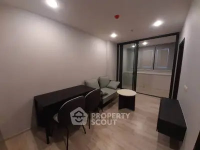 Modern living room with sleek furniture and large windows