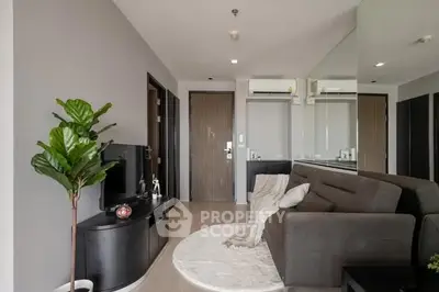 Modern living room with sleek furniture and stylish decor in a contemporary apartment.