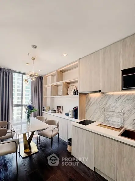 Modern kitchen with open layout and elegant dining area in luxury apartment