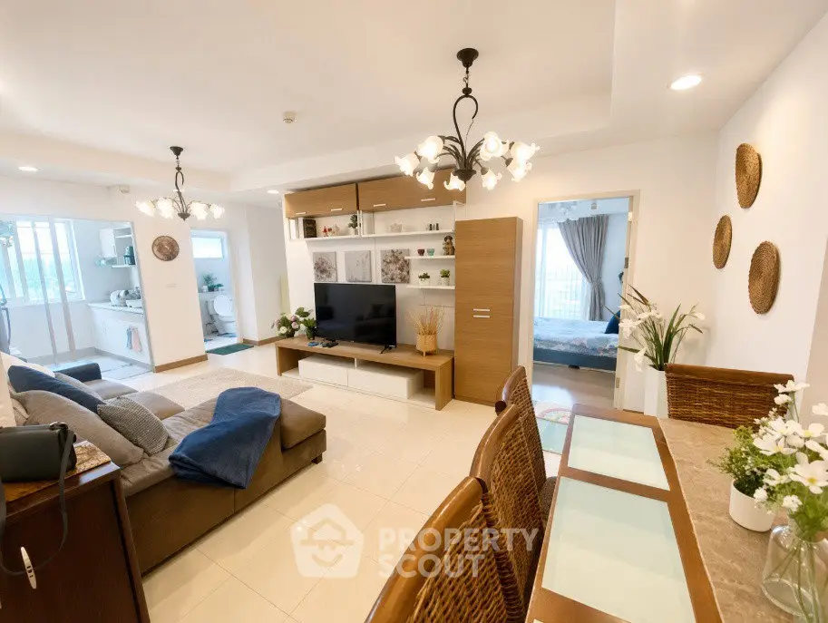 Spacious modern living room with elegant decor and open layout, perfect for family gatherings.