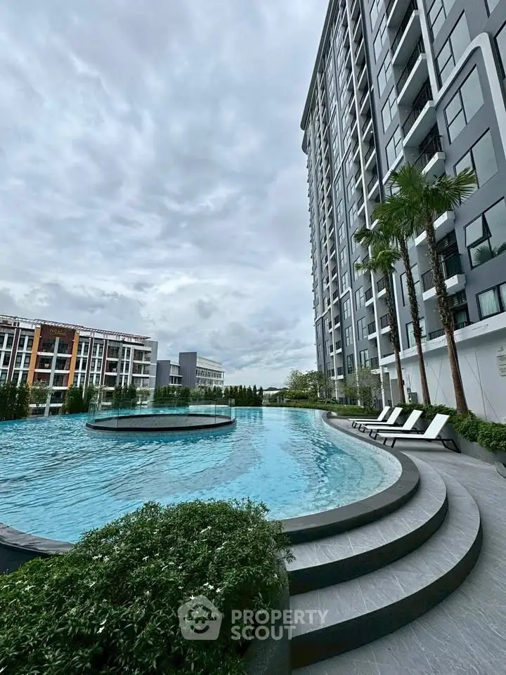 Luxurious condominium with stunning pool and modern architecture, perfect for urban living.