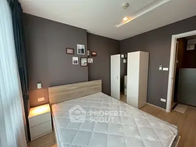 Modern bedroom with stylish decor and ample natural light