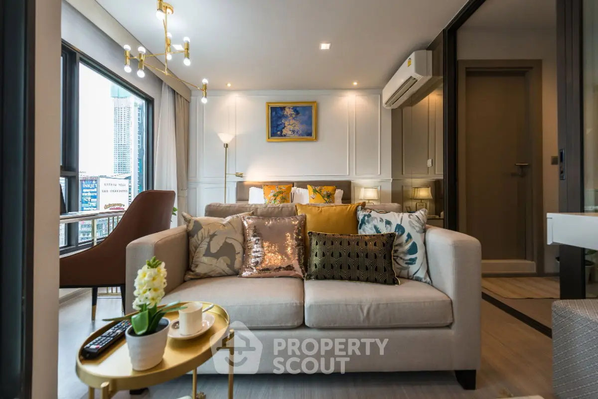 Modern living room with stylish decor and city view, featuring cozy sofa and elegant lighting.