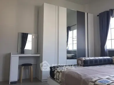 Modern bedroom with sleek wardrobe and stylish decor