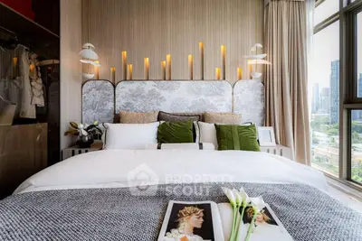 Luxurious bedroom with elegant decor and city view, featuring stylish lighting and plush bedding.