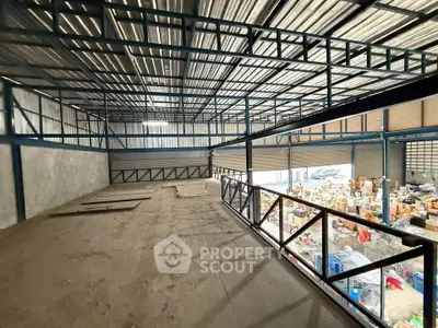 Spacious industrial warehouse with mezzanine and ample storage space