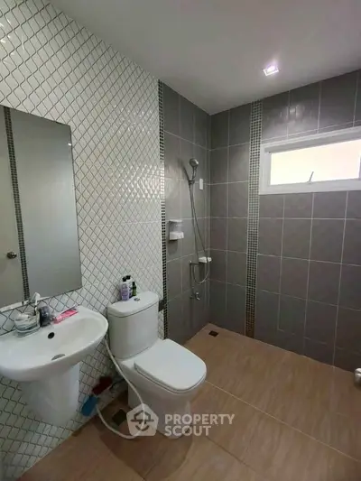 Modern bathroom with sleek tiles and contemporary fixtures