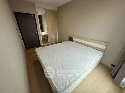 Spacious bedroom with modern design and large wardrobe