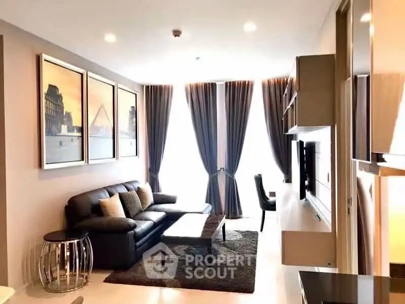 Modern living room with elegant decor, large windows, and stylish furniture in a contemporary apartment.