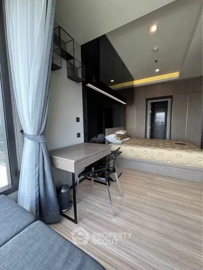 Modern bedroom with sleek design, featuring a cozy bed, stylish desk, and large window with elegant curtains.