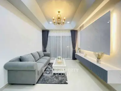 Elegant living room with modern decor and chandelier lighting