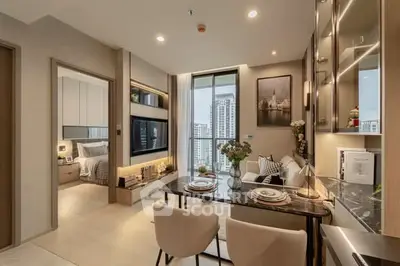 Modern open-plan living and dining area with city view, elegant decor, and cozy ambiance.