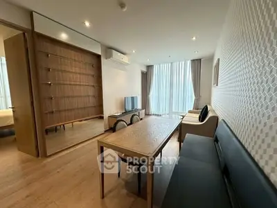 Modern living room with stylish furniture and large windows for natural light.